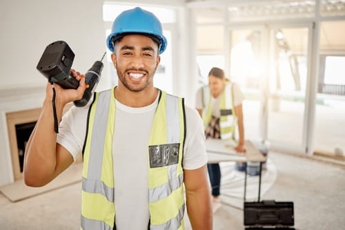 ad615eda-495a-4f3f-b092-1b449e6966e3.portrait-man-construction-home-renovation-with-drill-helmet-working-mindset-apartment-yes-smile-diy-renovations-happy-handyman-safety-building-project-tools-new-house